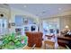 Living room with hardwood floors, leather furniture, built-in shelving, and backyard access at 6555 Lake Clark Dr, Lakeland, FL 33813