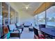 Bright and airy screened porch with wicker furniture and lake view at 6555 Lake Clark Dr, Lakeland, FL 33813