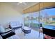 Relaxing screened porch overlooking a lake, perfect for outdoor enjoyment at 6555 Lake Clark Dr, Lakeland, FL 33813
