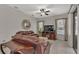 Comfortable living room with leather couches, a TV stand, and plenty of natural light at 7406 Summit Pl, Lakeland, FL 33810