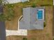 Home with gray roof and pool, viewed from above at 7738 Merrily Way, Lakeland, FL 33809