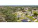 Aerial view of a house and surrounding neighborhood at 812 Del Prado Dr, Kissimmee, FL 34758