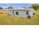 Home with solar panels and a spacious backyard at 812 Del Prado Dr, Kissimmee, FL 34758