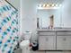 Clean bathroom with double vanity and shower/tub combo at 812 Del Prado Dr, Kissimmee, FL 34758