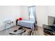 Small bedroom featuring a twin bed and window at 812 Del Prado Dr, Kissimmee, FL 34758