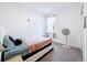 Bedroom with a queen bed, nightstand, and fan at 812 Del Prado Dr, Kissimmee, FL 34758