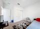 Bright bedroom with double bed and closet at 812 Del Prado Dr, Kissimmee, FL 34758