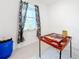 Small game room with tile floor and a dominoes table at 812 Del Prado Dr, Kissimmee, FL 34758