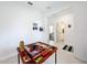 Game room with a dominoes table, hallway access to other rooms at 812 Del Prado Dr, Kissimmee, FL 34758