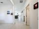 Bright hallway with tile floors and access to living areas and bedrooms at 812 Del Prado Dr, Kissimmee, FL 34758