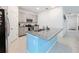 Modern kitchen with light gray cabinets and a blue island at 812 Del Prado Dr, Kissimmee, FL 34758