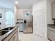 Modern kitchen with stainless steel appliances and ample cabinet space at 812 Del Prado Dr, Kissimmee, FL 34758