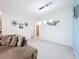 Living room with gray sectional sofa and access to backyard at 812 Del Prado Dr, Kissimmee, FL 34758