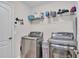 Laundry room with washer, dryer, and overhead shelving at 8163 Campbell Crossing Cir, Lakeland, FL 33810