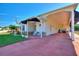 House exterior showcasing a covered entryway and carport at 1039 Motorcoach Dr, Polk City, FL 33868