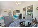 Relaxing sunroom featuring wicker furniture, a dining table, and a TV at 1039 Motorcoach Dr, Polk City, FL 33868