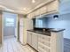 Modern kitchen with white appliances and gray cabinets at 1130 N Lake Parker Ave # A302, Lakeland, FL 33805