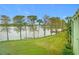 Scenic view of a lake with lush green grass and palm trees at 1130 N Lake Parker Ave # A302, Lakeland, FL 33805