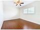 Bright bedroom with wood floors and window shutters at 1130 N Lake Parker Ave # A306, Lakeland, FL 33805