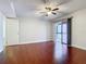 Bedroom with hardwood floors and access to balcony at 1130 N Lake Parker Ave # A306, Lakeland, FL 33805