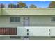 Exterior view of condo building, showing building facade and individual unit entrance at 1130 N Lake Parker Ave # A306, Lakeland, FL 33805