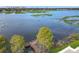 Aerial view of peaceful lake with dock and lush greenery at 1130 N Lake Parker Ave # A306, Lakeland, FL 33805