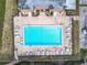 Overhead view of community pool and surrounding lounge chairs at 1130 N Lake Parker Ave # A306, Lakeland, FL 33805