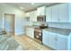 Spacious kitchen with stainless steel appliances and granite countertops at 1214 Tagliamento Ln, Haines City, FL 33844