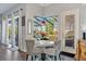 Casual breakfast nook with white table and patterned chairs near the pool at 1217 Vista Hills Dr, Lakeland, FL 33813