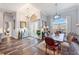 Bright dining area with hardwood floors and large arched windows at 1217 Vista Hills Dr, Lakeland, FL 33813