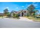 Exterior view of a lovely house with a large driveway and landscaping at 1217 Vista Hills Dr, Lakeland, FL 33813