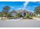 House exterior with a large driveway and manicured landscaping at 1217 Vista Hills Dr, Lakeland, FL 33813