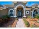 Grand entrance with double doors, arched entryway, and a brick walkway at 1217 Vista Hills Dr, Lakeland, FL 33813