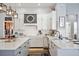 Modern kitchen with white and gray cabinets and stainless steel appliances at 1217 Vista Hills Dr, Lakeland, FL 33813