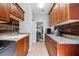 Well-lit laundry room with cabinets and a view to another room at 1217 Vista Hills Dr, Lakeland, FL 33813