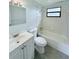 Updated bathroom with white vanity and bathtub at 122 8Th Se St, Fort Meade, FL 33841