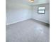 Spacious bedroom with tile floors and a window at 122 8Th Se St, Fort Meade, FL 33841