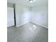 Simple bedroom with tile floors and closet at 122 8Th Se St, Fort Meade, FL 33841