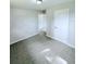 Bedroom with tile floor and access to another room at 122 8Th Se St, Fort Meade, FL 33841