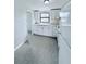 White kitchen with new appliances and tile floors at 122 8Th Se St, Fort Meade, FL 33841