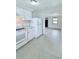 Eat-in kitchen with white cabinets and tile floor at 122 8Th Se St, Fort Meade, FL 33841