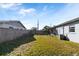 Fenced backyard with grassy area and shed at 127 Colonial Dr, Auburndale, FL 33823