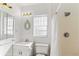 Simple bathroom with shower, toilet and vanity at 127 Colonial Dr, Auburndale, FL 33823