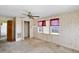 Bedroom with wood paneling, carpet and closet at 127 Colonial Dr, Auburndale, FL 33823