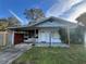 Charming single story home with covered porch at 127 Colonial Dr, Auburndale, FL 33823