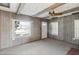 Living room with wood paneling and window at 127 Colonial Dr, Auburndale, FL 33823