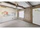 Living room with wood paneling and nautical mural at 127 Colonial Dr, Auburndale, FL 33823