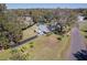 Aerial view of a single story home with a fenced backyard, pool and large lot at 1317 W Belmar St, Lakeland, FL 33815