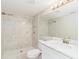 Updated bathroom with a walk-in shower and white vanity at 1317 W Belmar St, Lakeland, FL 33815