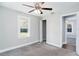 Bright bedroom with carpet, ceiling fan, and spacious closet at 1317 W Belmar St, Lakeland, FL 33815